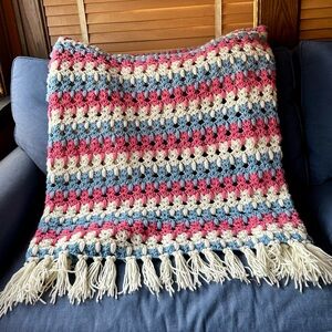New, unused hand crocheted throw with yarn fringe